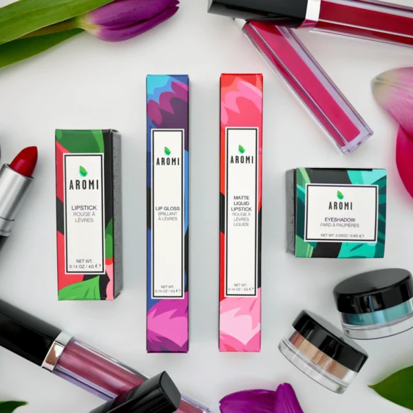 Aromi brand cosmetic packaging with lipsticks and lip glosses.