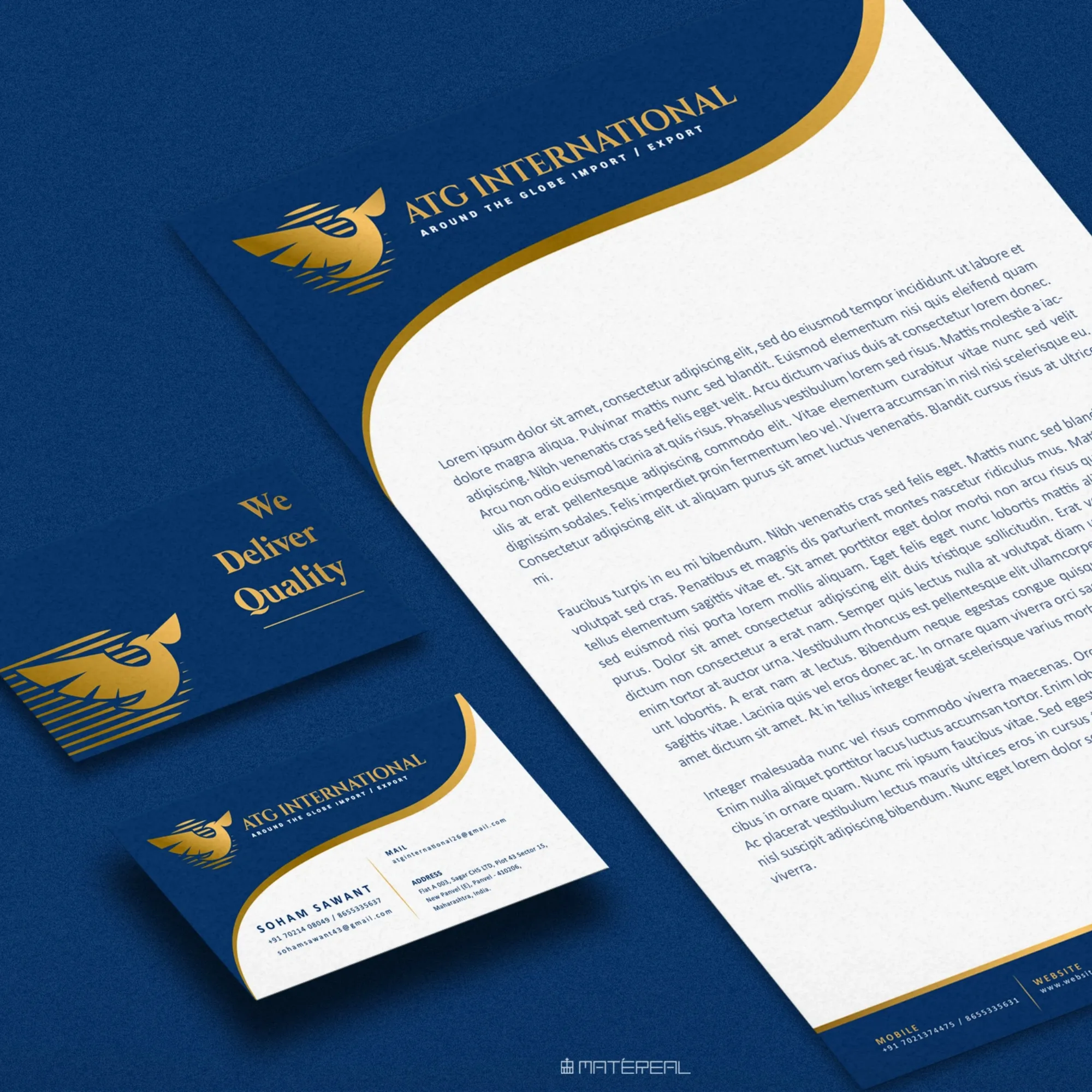Blue letterhead and business card set with gold accents for "ATG International."