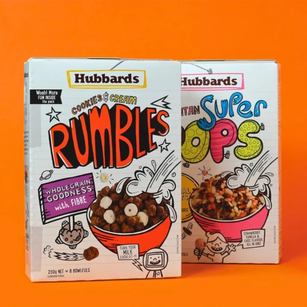 Two Hubbard’s cereal boxes featuring fun designs and colorful branding against an orange background.