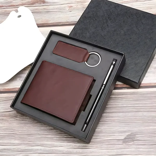 Leather wallet gift set with keychain and pen in a black box.