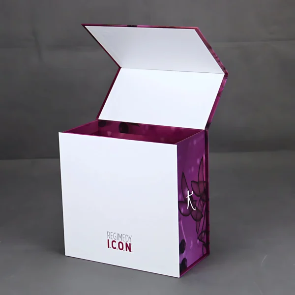 A purple flip top magnetic lock box with a floral design. The box is open and the inside is visible. The box has the words "Regimedy Icon" on the side in white.