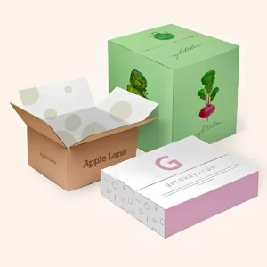 Three custom cardboard shipping boxes in various designs and colors.
